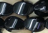 CAA2486 15.5 inches 10*14mm twisted rice black agate beads