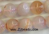 CAA3643 15.5 inches 6mm round sakura agate beads wholesale