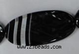 CAG3086 15.5 inches 25*50mm faceted oval black line agate beads