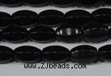 CAG6029 15.5 inches 6*10mm faceted rice matte black agate beads
