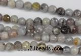 CAG7870 15.5 inches 4mm faceted round silver needle agate beads