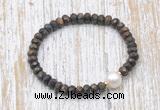 CFB754 faceted rondelle bronzite & potato white freshwater pearl stretchy bracelet