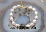 CFB966 Hand-knotted 9mm - 10mm rice white freshwater pearl & golden obsidian bracelet