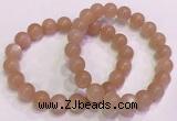 CGB4588 7.5 inches 10mm - 11mm round sunstone beaded bracelets