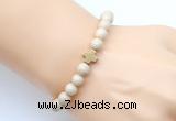 CGB9360 8mm, 10mm white fossil jasper & cross hematite power beads bracelets