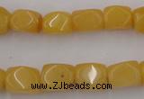CNG807 15.5 inches 9*12mm faceted nuggets yellow jade beads