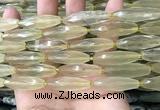 CRI132 15.5 inches 10*30mm faceted rice lemon quartz beads