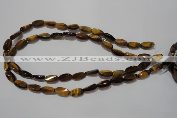 CTE1097 15.5 inches 8*15mm twisted & faceted oval yellow tiger eye beads