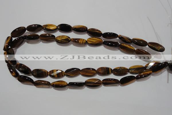 CTE1098 15.5 inches 10*20mm twisted & faceted oval yellow tiger eye beads