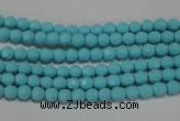 CTU1220 15.5 inches 4mm faceted round synthetic turquoise beads